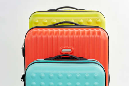 Row of suitcases, cropped image. Set of bags, white background.の写真素材