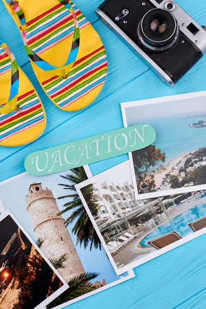 Concept of summer vacation. Flip-flop, camera, message, different pictures.の写真素材