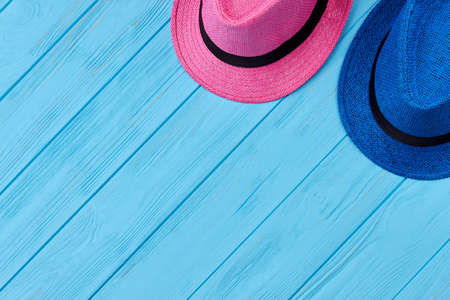 Caps for sun protection isolated. Two hats on sea background. Concept of summer holiday.の写真素材