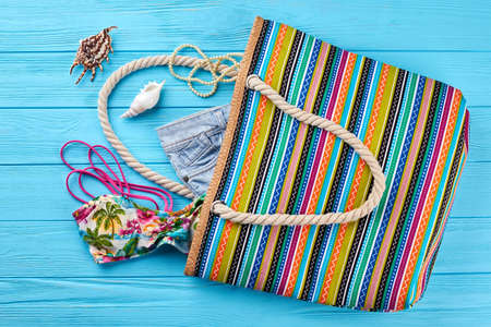 Modern textile handbag for women. Casual striped bag, personal beach accessories. Concept of summer...