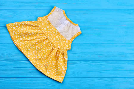 Summer toddlers natural dress. Vintage baby-girl dress with embroidery, copy space. Infant girl summer fashion.の写真素材