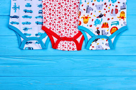 Cute organic baby summer bodysuits. Set of beautiful rompers for summer wear. Infant baby patterned jumpsuits and copy space. Shop organic childs clothing.の写真素材