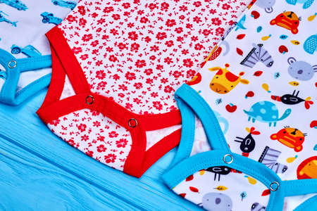 Detail of organic bodysuits for newborn. Modern brand cotton baby rompers close up. Infant child natural summer wear.の写真素材