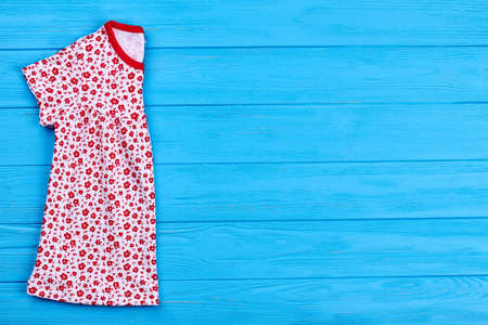 New organic dress for little girls. Infant baby cotton patterned dress and copy space. Toddlers girls textile clothing.の写真素材