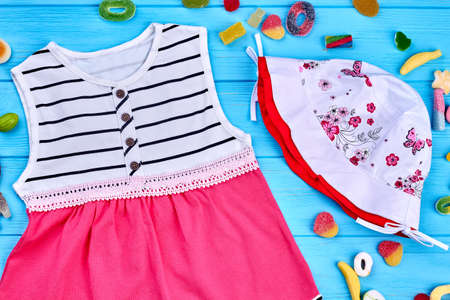 Baby-girl summer clothes, accessories. Little girl fashion design sundress and hat close up. Kids fashion outfit.の写真素材