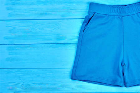 Kids blue textile summer shorts. Toddlers short pants for casual wear, copy space. Brand fabric shorts for little boys.の写真素材