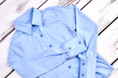 New light blue formal shirt. Girls beautiful brand long sleeve blue blouse. Delicate blue button shirt.の写真素材