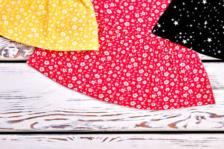 Cropped image of baby-girl dresses. Toddler girl cotton casual clothes close up. Little girls summer apparel.の写真素材
