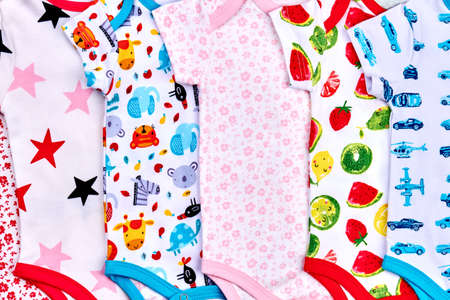 Baby soft rompers close up. Infant baby new patterned bodysuits on sale. Summer rompers set for...