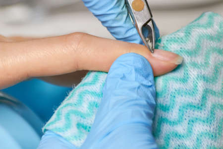 Cutting the cuticle close up. Preparing nails before manicure, trimming cuticles. Skin and nails...