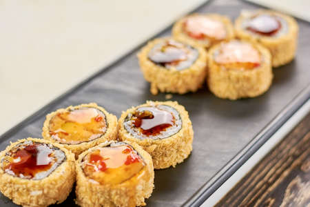 Delicious rolls unagi furai. Appetizing set of japanese sushi on plate. Asian traitional food.の写真素材