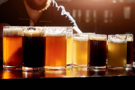 Assorted beers for tasting. Different sorts of draft beers. Set of alcoholic beverage.の写真素材