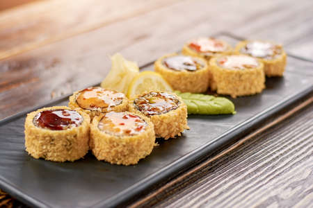 Sushi rolls with eel and avocado. Unagi furay sushi rolls. Traditional japanese food.の写真素材