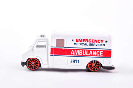 Toy emergency ambulance, white background. Toy ambulance car isolated on white background, side view.の写真素材