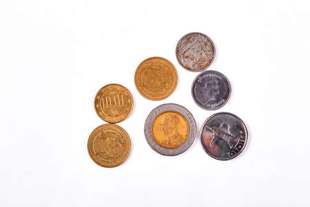 Gold and silver ancient coins. Different kinds of antique coins isolated on white background.の写真素材