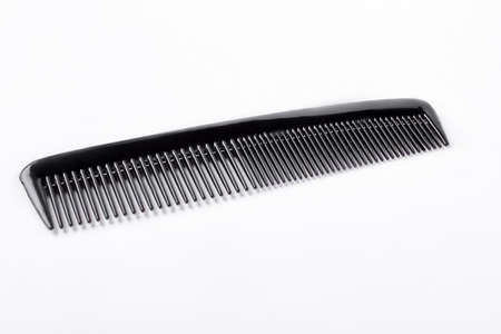 Studio shot of barber comb isolated on white background. Simple hair comb.の写真素材