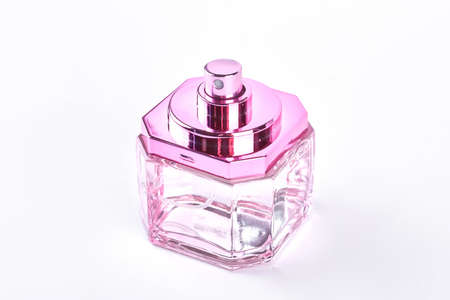 Woman perfumes empty transparent bottle. Pink empty bottle of woman perfume isolated on white background.の写真素材
