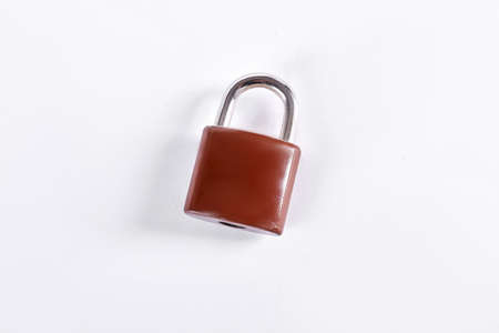Brown padlock on white background. New lock isolated on white background. Security and protection concept.の写真素材
