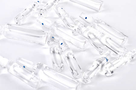 Glass ampoules with liquid for injections. Medical ampoules with transparent medicine liquid close...