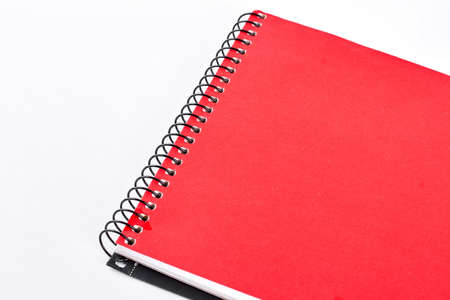 Red notepad on white background. Red notebook or writing pad isolated on white background. Craft paper notebook.の写真素材