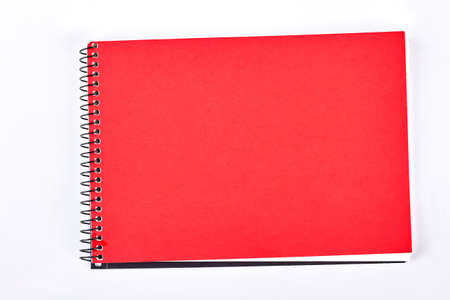 Spiral binder notebook, white background. Red notebook or writing pad isolated on white background. New paper notepad.の写真素材