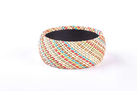 Female fashion handmade bracelet. Woman stylish patterned bracelet isolated on white background. Woman luxury accessory.の写真素材