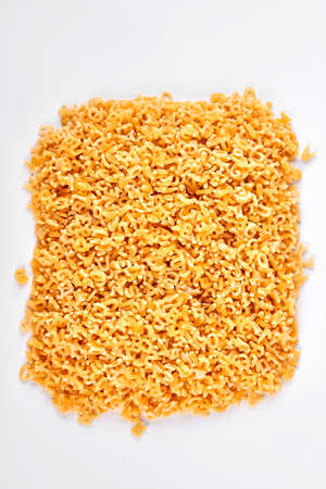 Square pile of stelline pasta little letters on white background, top view. Italian pasta of premium quality.の写真素材