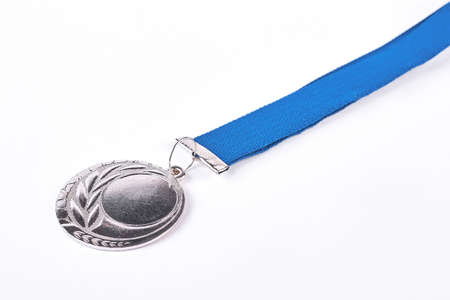 Champion silver medal, white background. Symbol of championship and victory.の写真素材