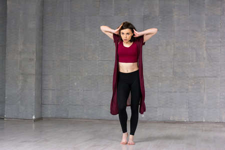 Sexy young hip hop dancer. Pretty dancer girl posing on studio background. Young female dancer.の写真素材