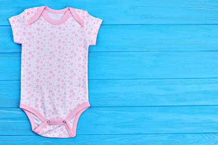 Cute natural bodysuit for girl. Fashion design cotton romper for toddler girl and copy space. Baby-girl brand clothing on sale.の写真素材