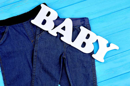 Close up of stretch jeans for babies. Kids new brand jean pants on sale. Toddler fashion jean outfit.の写真素材