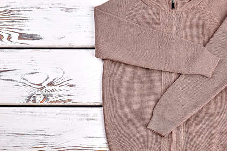 New brown knitted pullover close up. High quality brown cardigan for kids casual wear. Autumn warm...