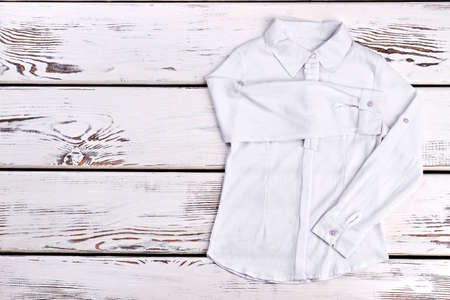 Autumn shirt, school girl blouse. Girls white long sleeeve shirt for school wear, copy space. Girls brand school outfit.の写真素材