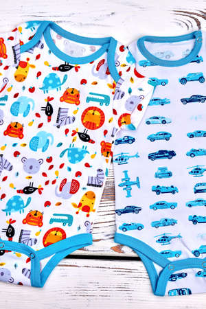 Newborn kids organic patterned bodysuits. Infant kids set of fashion design summer rompers, top view. Baby soft bodysuits.の写真素材