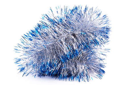 Close up silver and blue tinsel. Silver and blue Christmas garland isolated on white background....