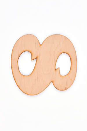Decorative wooden alphabet digit eight symbol. Carved wooden number eight isolated on white...