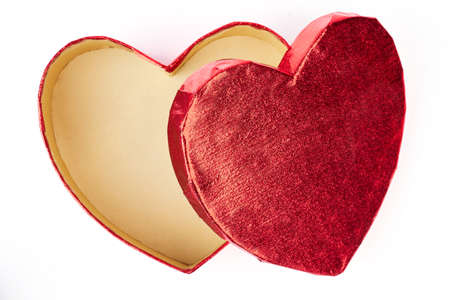 Open empty heart-shaped gift box. Elegant red gift box in a shape of heart isolated on white...