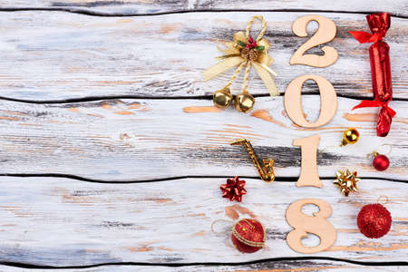 Wooden number 2018 with Christmas ornaments. Sign symbol from number 2018 on old white wooden texture background, copy space. Happy New Year 2018.の写真素材