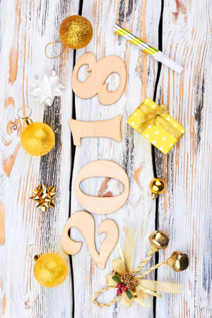Happy 2018 New Year background. Wooden number 2018 and Christmas ornaments on old wooden background, top view. Happy New Year and Christmas concept.の写真素材