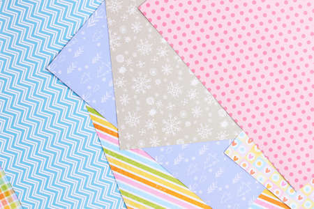 Paper background with winter design. Sheets of patterned paper for handmade New Year and Christmas ornaments, top view.の写真素材