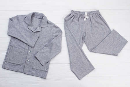 Boys pajama set on white. Soft gray melange cotton. Loose-fitting shirt and pants for comfort rest at night.の写真素材