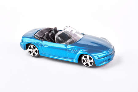 Blue metal cabriolet car toy. Fashion design cabriolet car toy isolated on white background.