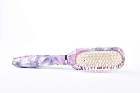 Elegant hair brush on white bacground. Fashion design female hair brush isolated on white...