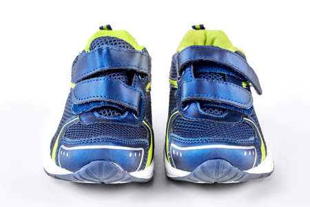 Sport trainers on white background. Blue and green sport shoes isolated on white background. Pair of new sport shoes.の写真素材