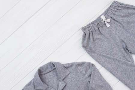 Gray pajama set on white. Cropped shot of shirt and pants. New nightwear for comfy sleep.の写真素材