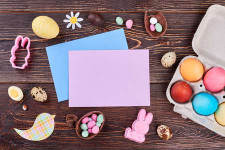 Easter card and handmade decorations. Easter handmade background from chocolate, rabbit molds,...