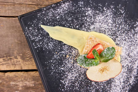 Mille-feuille napoleon pastry. Napoleon cake with apple, strawberry and cream.の写真素材