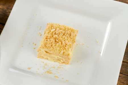 Top view napoleon cake on plate. Square piece of cake on plate.の写真素材