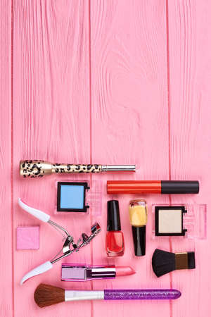 Collection of makeup products, top view. Flat lay of glamour cosmetics for makeup on color background, space for text.の写真素材
