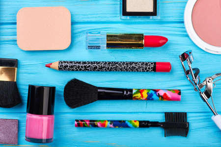 Fashion cosmetic makeup. Fashion design lipstick, brushes, nail polish, compact blusher. Woman beauty accessories set.の写真素材